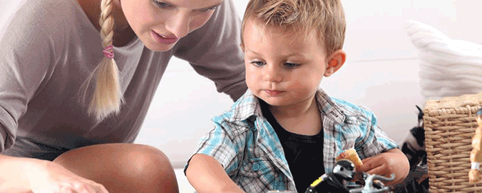 Woman Showing Paper to a Child