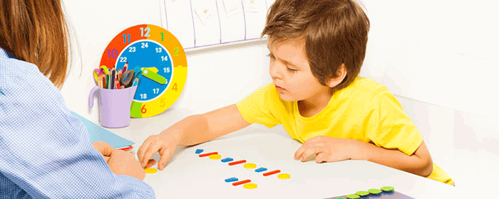 child being tested for autism within a classroom