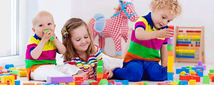 3 children playing with toys