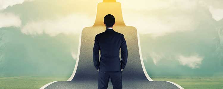 business man climbing steep road